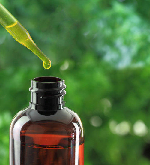 Dropper over essential oil bottle